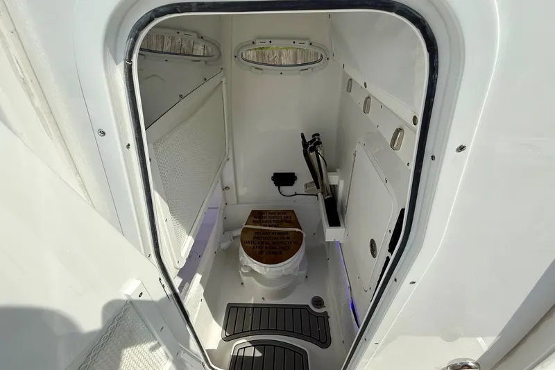 Slide: The Image of Interior view of 2026 Sea Hunt Gamefish 25 boat's compact restroom. - 14