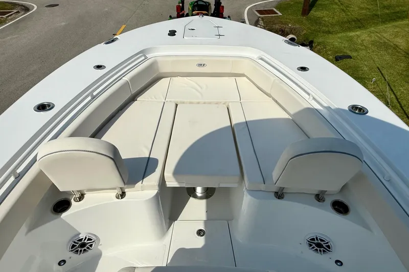 Slide: The Image of 2026 Sea Hunt Gamefish 25 boat interior with cushioned seating and deck view. - 15