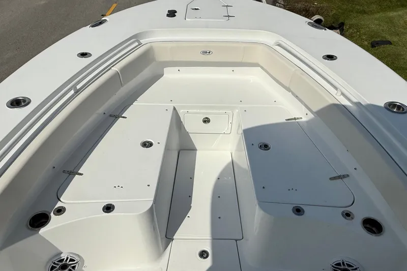 Slide: The Image of 2026 Sea Hunt Gamefish 25 boat deck with storage compartments and seating. - 16