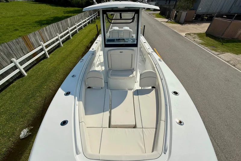 Slide: The Image of 2026 Sea Hunt Gamefish 25 boat with spacious seating and sleek design. - 18