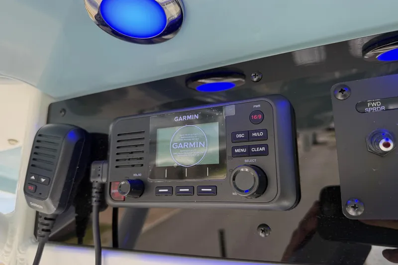 Slide: The Image of 2026 Sea Hunt Gamefish 25 boat console with Garmin marine radio and blue LED lights. - 20