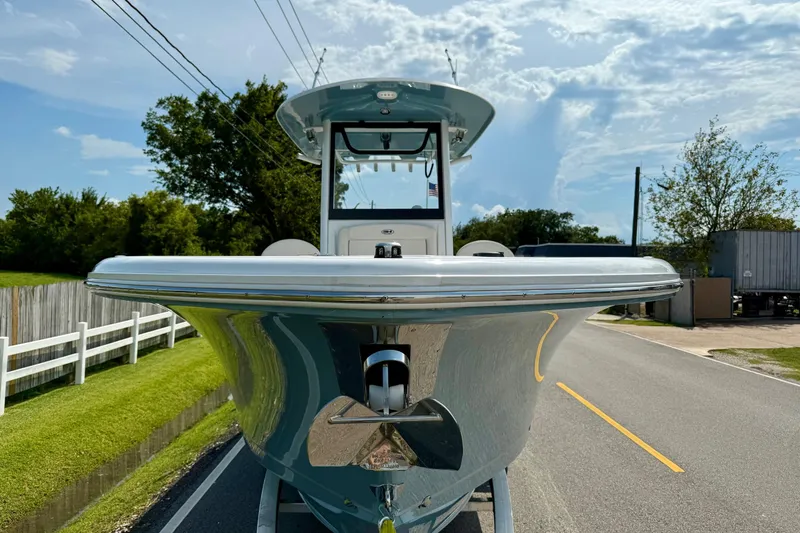 Slide: The Image of 2026 Sea Hunt Gamefish 25 boat on road, front view under sunny sky. - 6