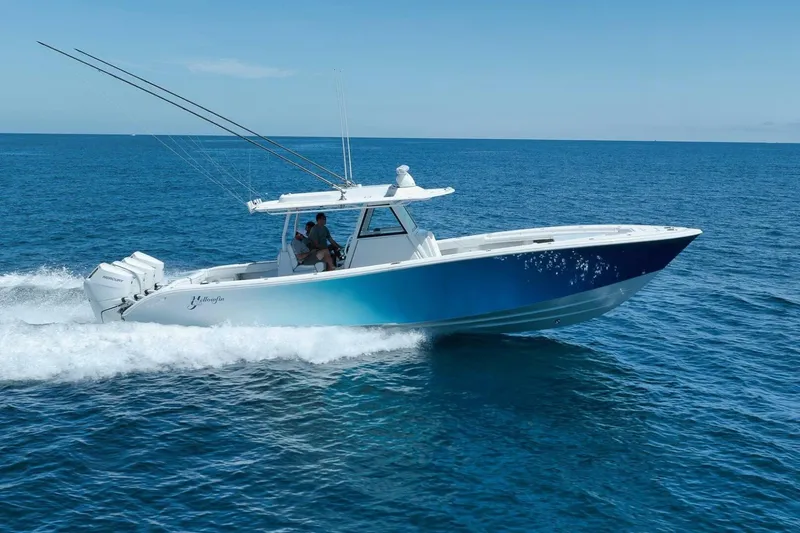 Slide: The Image of 2023 Yellowfin 39 Offshore boat cruising on open blue ocean waters. - 1