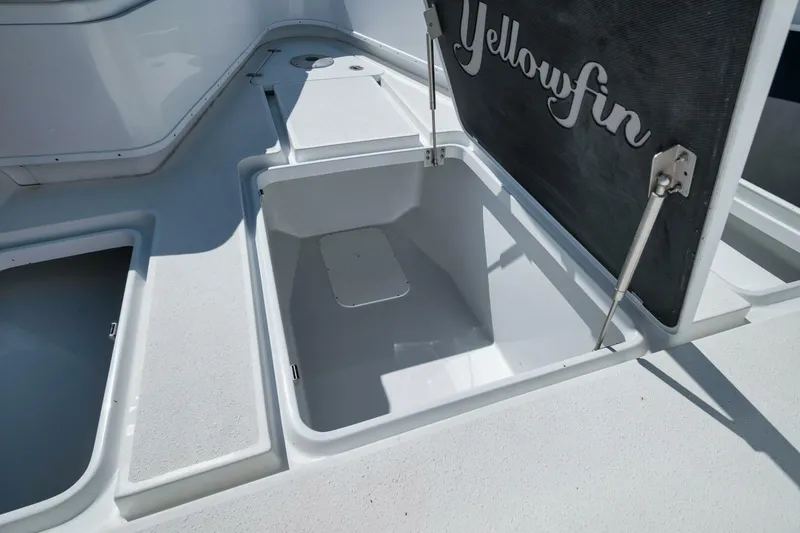 Slide: The Image of 2023 Yellowfin 39 Offshore boat storage compartment with open hatch. - 10