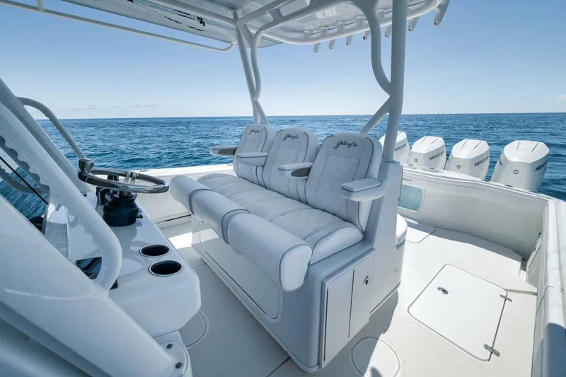 Slide: The Image of 2023 Yellowfin 39 Offshore boat interior with luxurious seating and ocean view. - 14