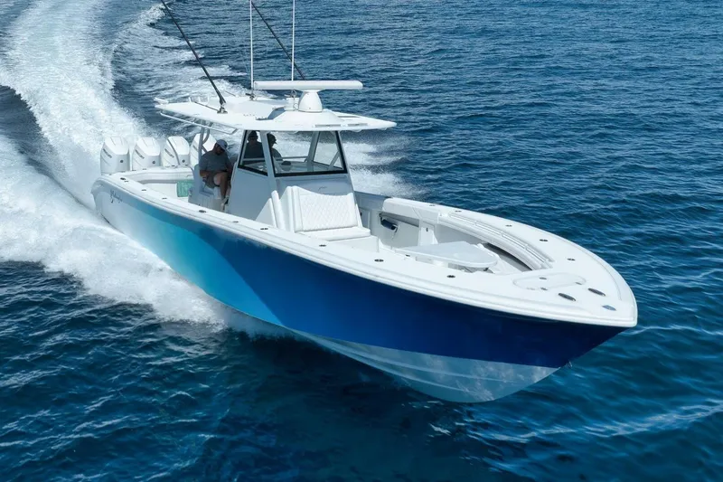 Slide: The Image of 2023 Yellowfin 39 Offshore boat cruising on open blue water. - 2