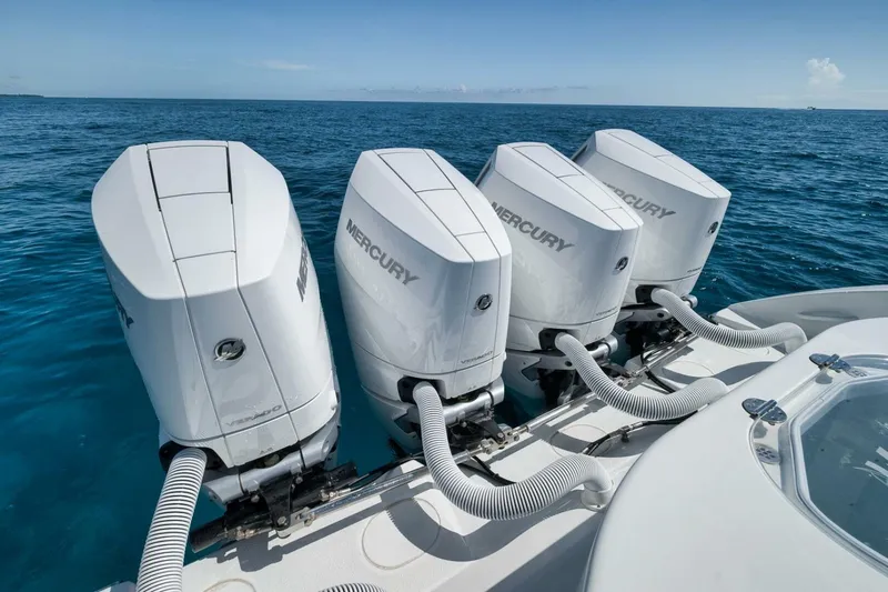Slide: The Image of 2023 Yellowfin 39 Offshore boat with four Mercury outboard engines on open water. - 22