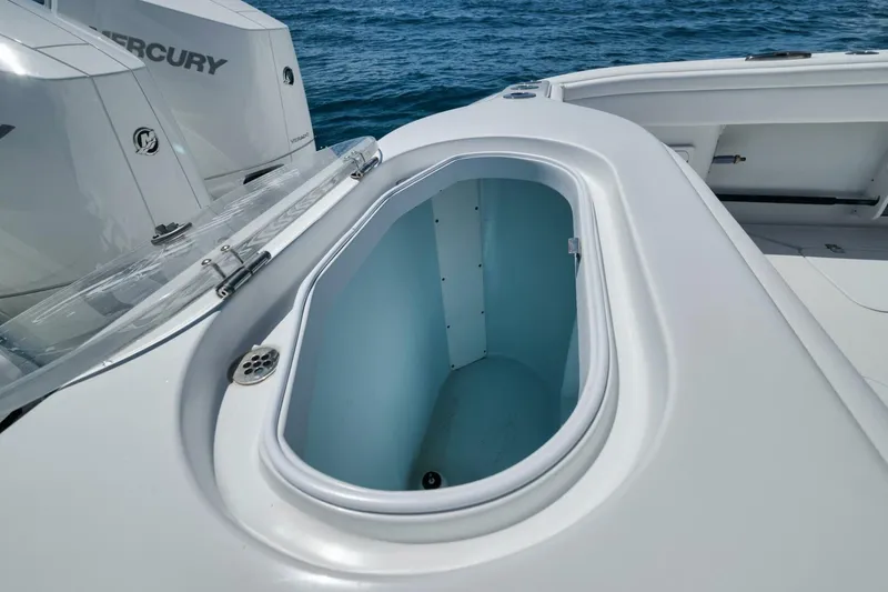 Slide: The Image of 2023 Yellowfin 39 Offshore boat with open storage compartment and Mercury engines. - 25