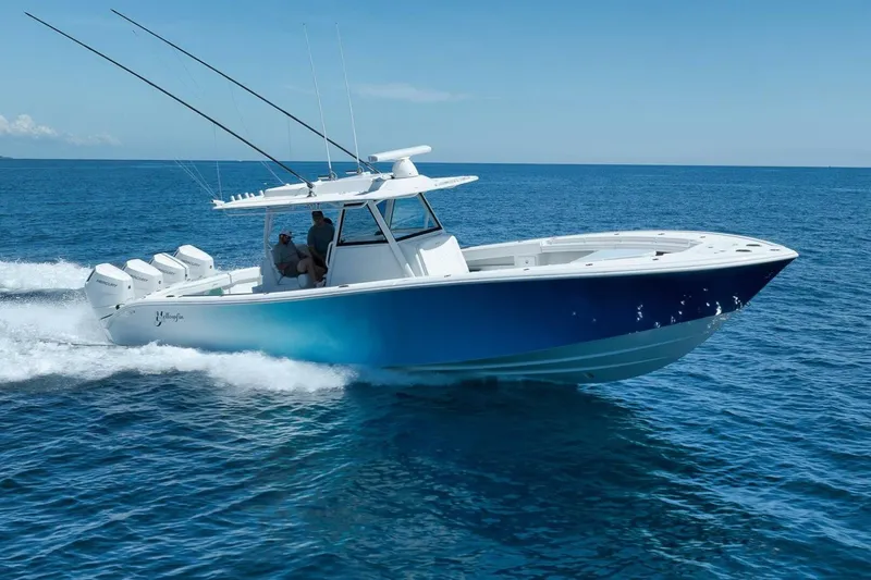 Slide: The Image of 2023 Yellowfin 39 Offshore boat cruising on open blue ocean waters. - 31