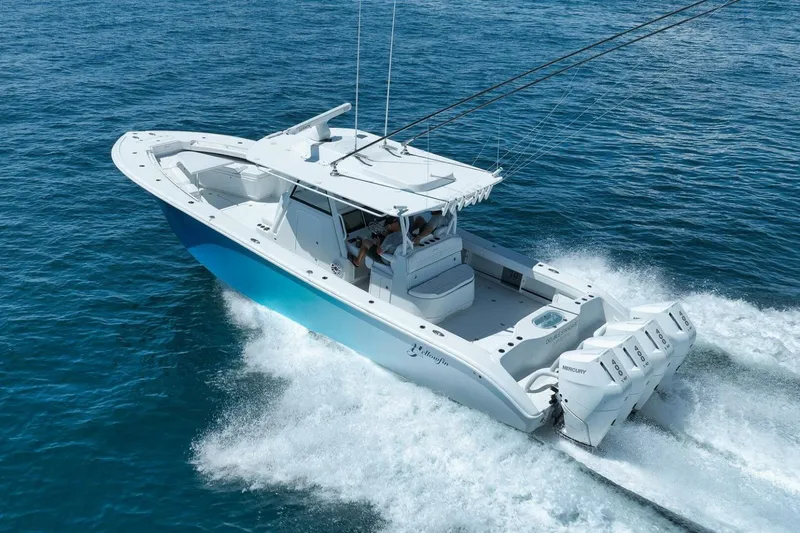 Slide: The Image of 2023 Yellowfin 39 Offshore boat cruising on open water, showcasing powerful engines. - 4