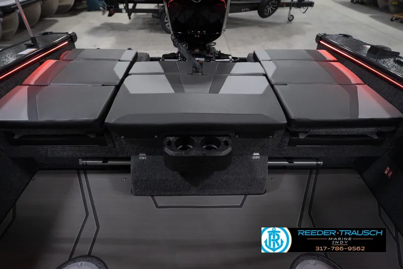 Slide: The Image of 2026 Lund 1875 Crossover XS boat interior with cushioned seating and red accent lighting. - 20