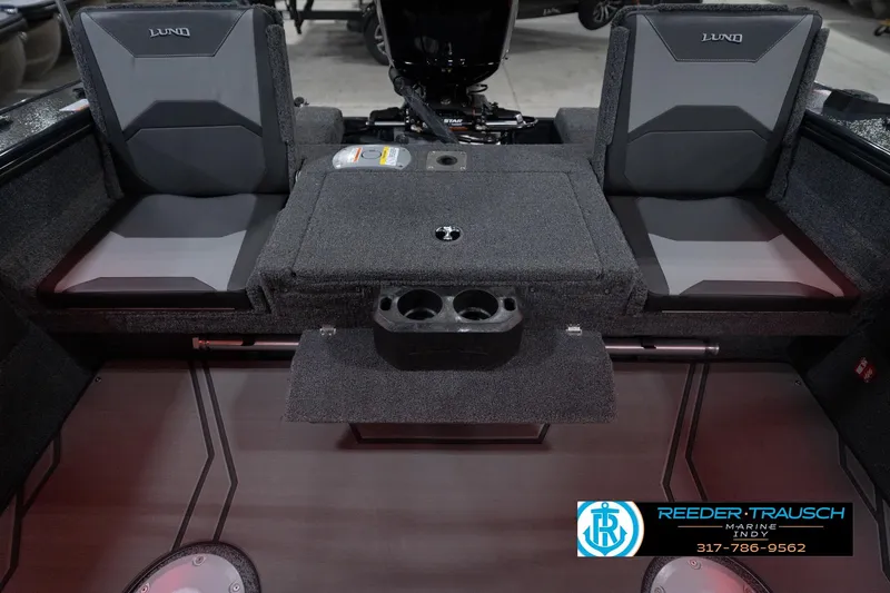 Slide: The Image of 2026 Lund 1875 Crossover XS boat interior with seating and storage compartments. - 21