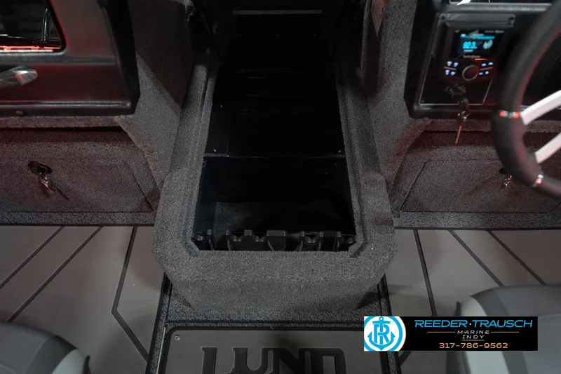 Slide: The Image of 2026 Lund 1875 Crossover XS interior with steering wheel and storage compartment. - 26