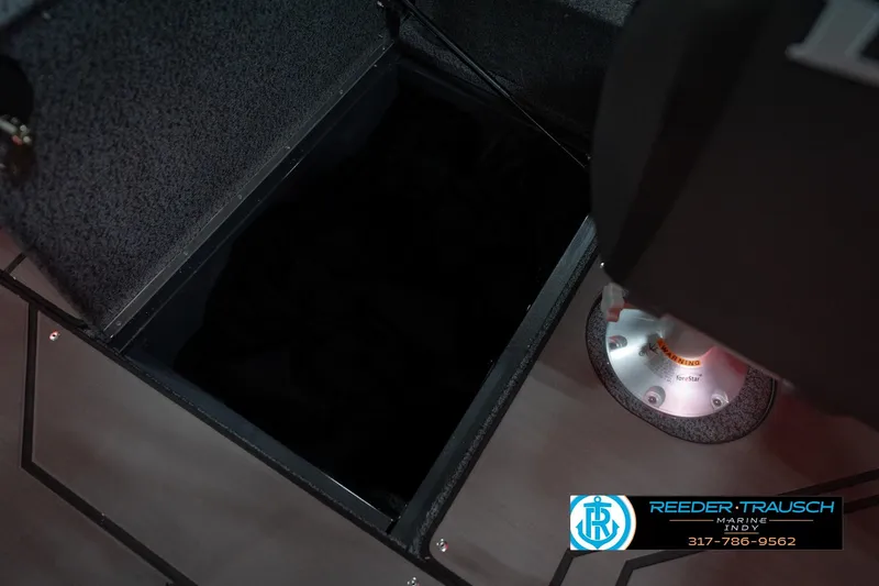 Slide: The Image of 2026 Lund 1875 Crossover XS boat interior storage compartment with seat base. - 28