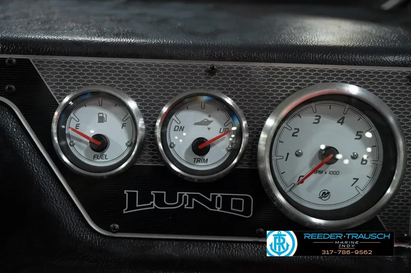 Slide: The Image of Dashboard of 2026 Lund 1875 Crossover XS with fuel, trim, and RPM gauges. - 37