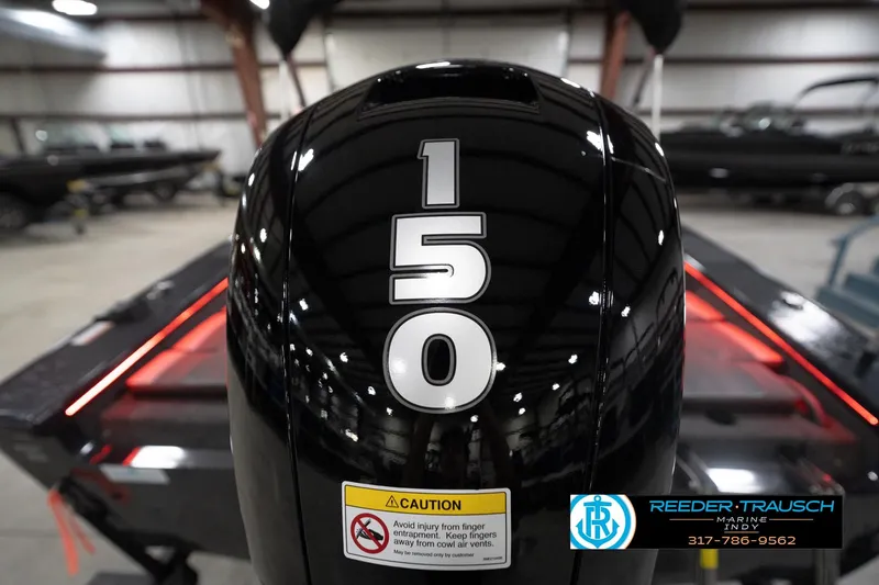 Slide: The Image of 2026 Lund 1875 Crossover XS boat engine with 150 horsepower in showroom. - 51