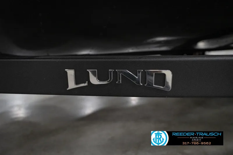 Slide: The Image of 2026 Lund 1875 Crossover XS boat logo with Reeder Trausch Marine branding. - 58