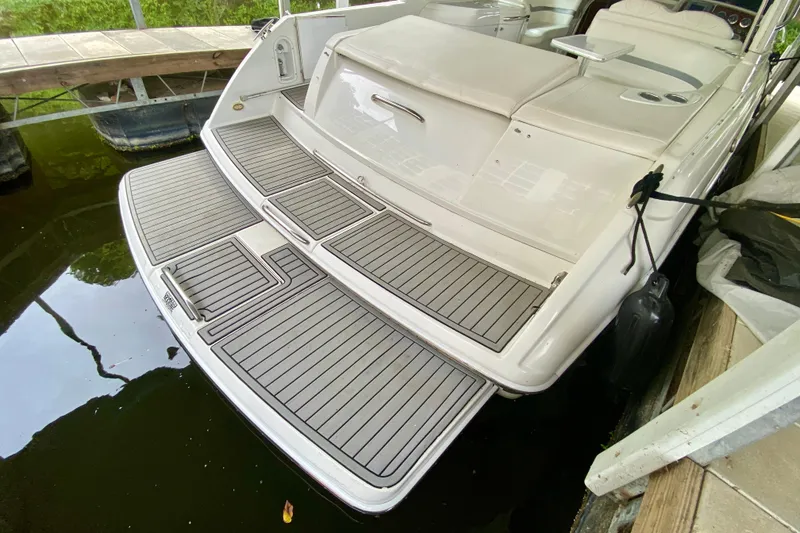 Slide: The Image of 2005 Formula 330 Sun Sport boat with spacious swim platform and sleek design. - 1