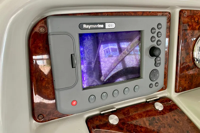 Slide: The Image of Raymarine C70 navigation system on 2005 Formula 330 Sun Sport boat dashboard. - 13
