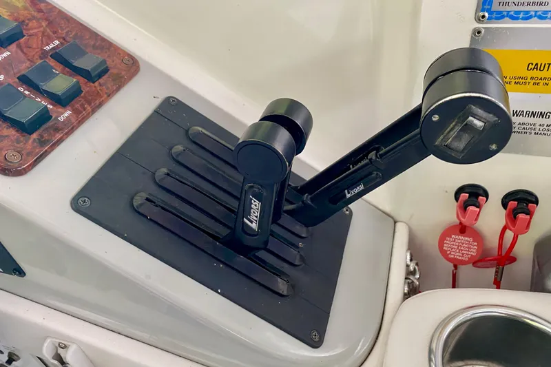 Slide: The Image of Control panel of a 2005 Formula 330 Sun Sport boat with throttle levers. - 14