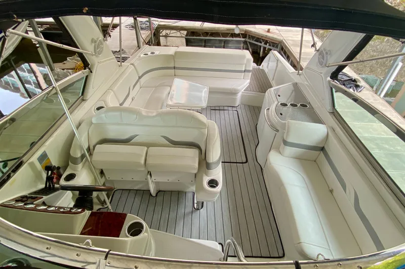 Slide: The Image of 2005 Formula 330 Sun Sport boat interior with white seating and sleek design. - 18