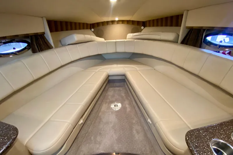 Slide: The Image of Interior of 2005 Formula 330 Sun Sport boat with beige seating and carpeted floor. - 21
