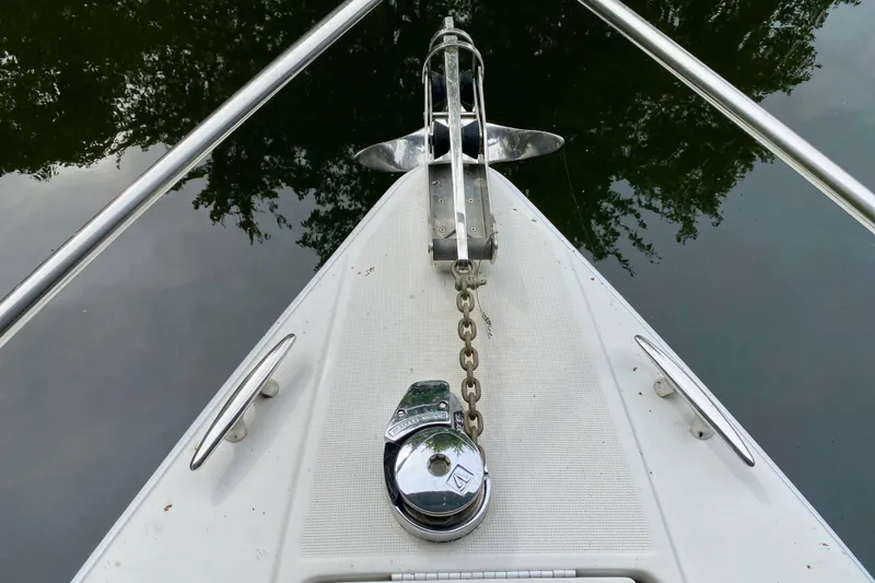 Slide: The Image of Bow of 2005 Formula 330 Sun Sport with anchor and chain on calm water. - 5