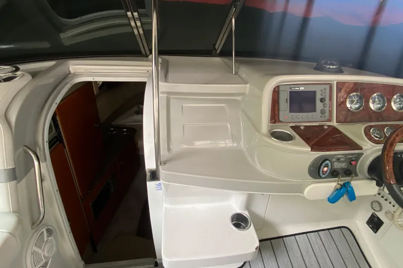 Slide: The Image of 2005 Formula 330 Sun Sport boat interior with control panel and cabin entrance. - 9