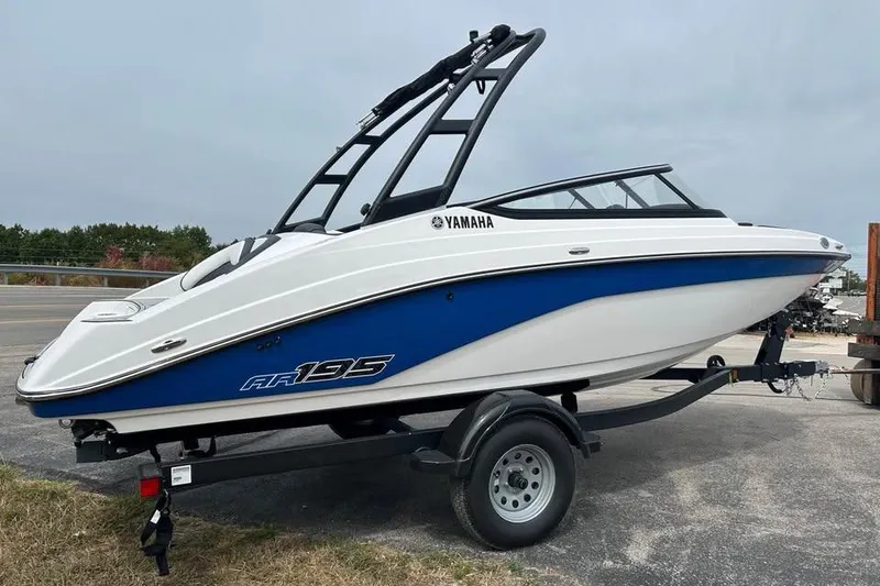 Slide: The Image of 2026 Yamaha AR195 boat on trailer, featuring sleek design and blue accents. - 4