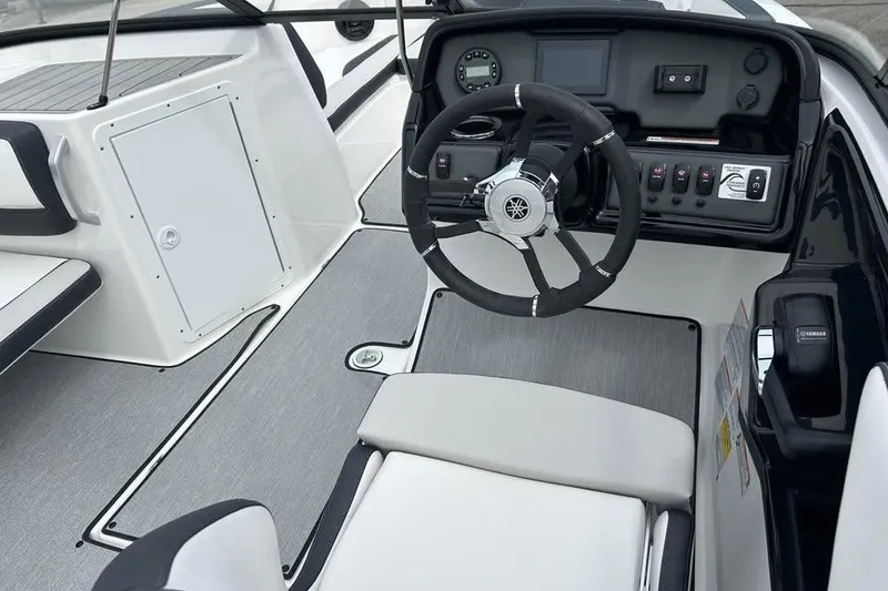 Slide: The Image of 2026 Yamaha Boats AR195 cockpit with steering wheel and control panel. - 7