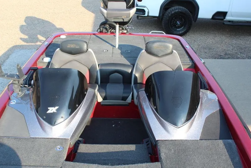 Slide: The Image of 2016 Skeeter ZX250 boat interior with dual seats and sleek design. - 13