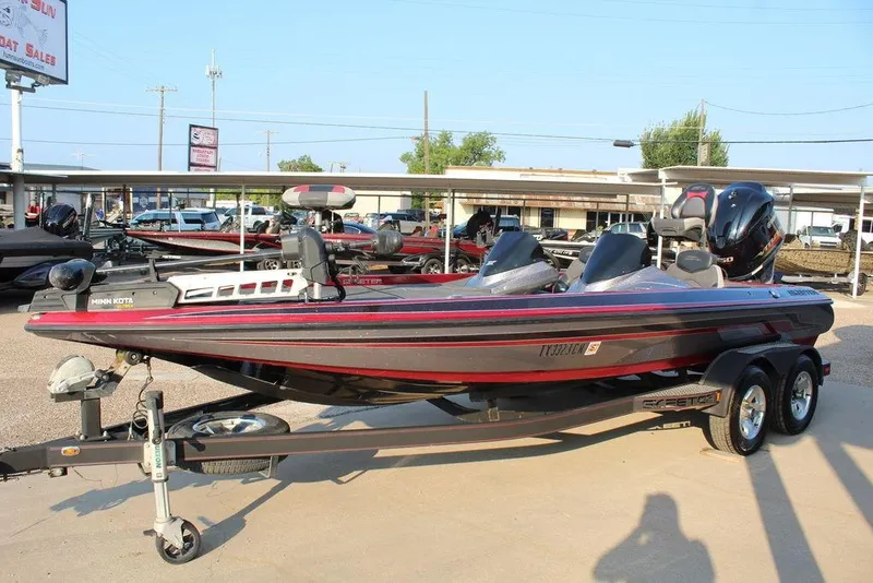 Slide: The Image of 2016 Skeeter ZX250 bass boat with trailer in a dealership lot. - 3