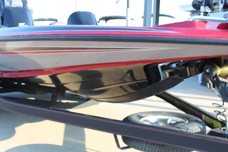 Slide: The Image of 2016 Skeeter ZX250 boat on trailer, showcasing sleek hull design. - 4