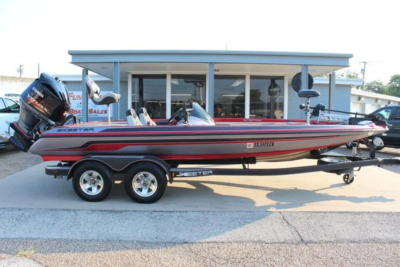 Slide: The Image of 2016 Skeeter ZX250 bass boat with Yamaha engine on trailer, parked outside dealership. - 7