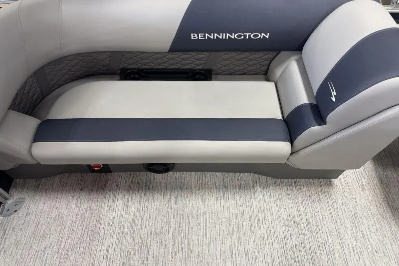 Slide: The Image of 2026 Bennington 22 SSRSE pontoon boat in a factory setting with workers. - 12