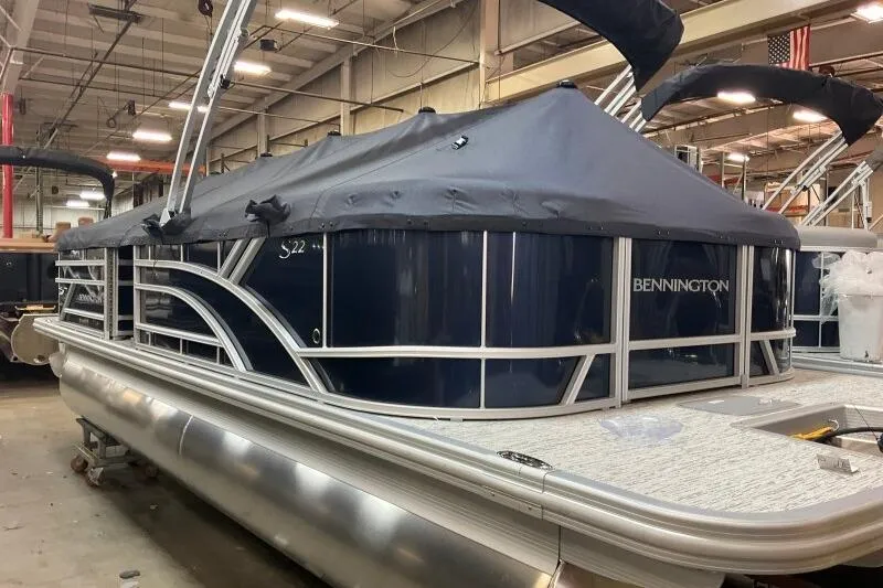 Slide: The Image of 2026 Bennington 22 SSRSE boat seat with gray and black upholstery, featuring quilted accents. - 18