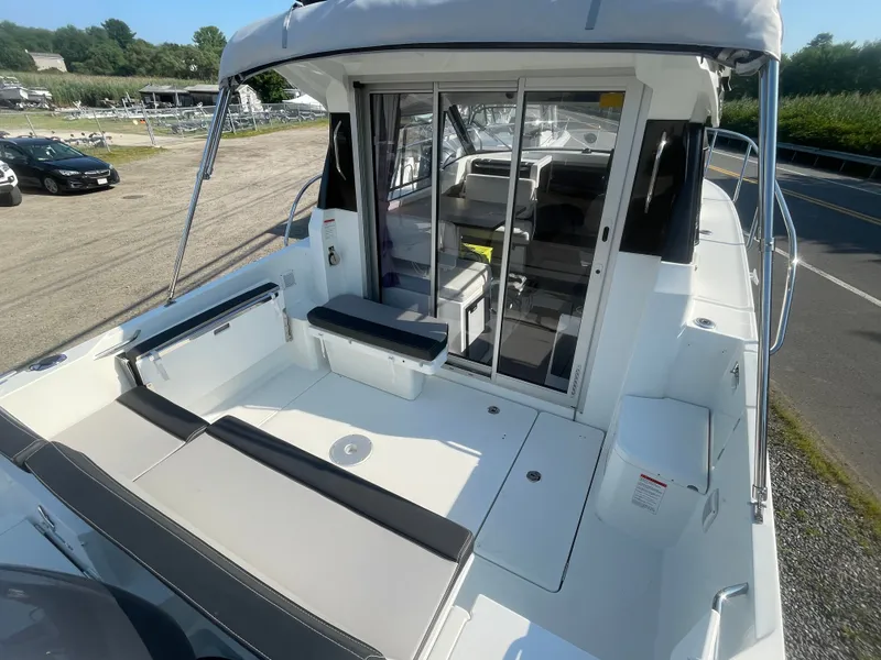 Slide: The Image of 2022 Jeanneau NC Weekender 795 Series 2 boat with spacious deck and seating area. - 10