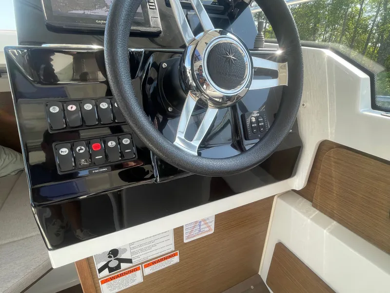 Slide: The Image of Steering wheel and controls of 2022 Jeanneau NC Weekender 795 Series 2 boat. - 17