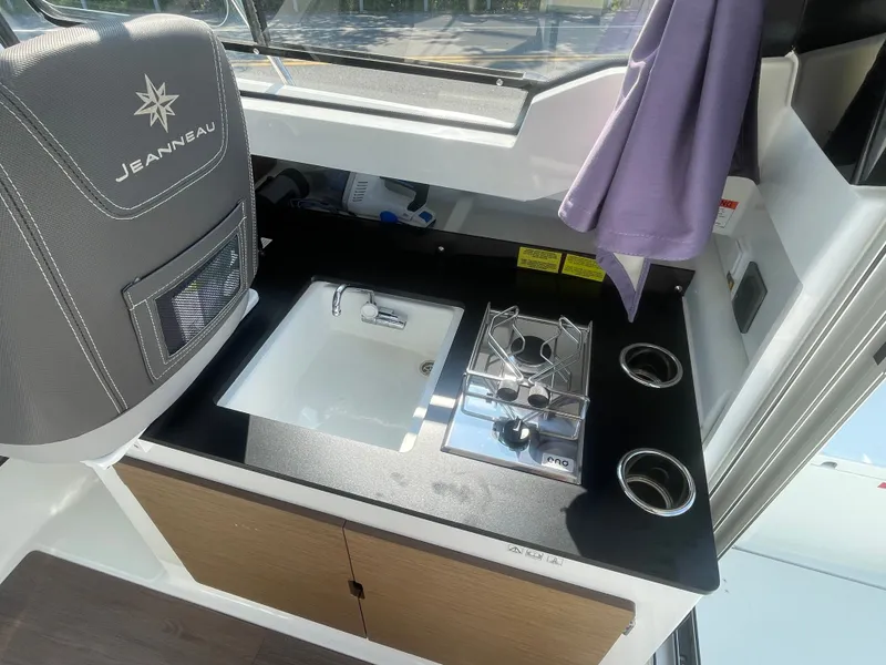 Slide: The Image of Compact kitchen area in 2022 Jeanneau NC Weekender 795 Series 2 boat. - 25