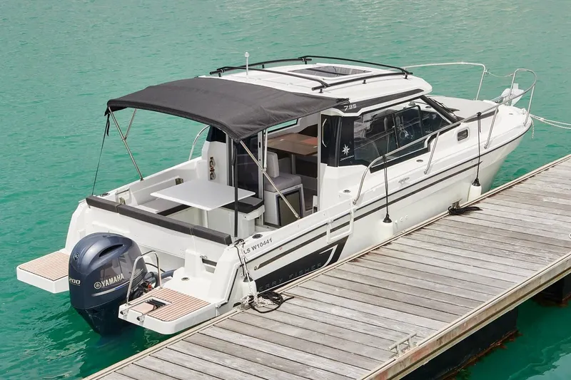 Slide: The Image of Manufacturer Provided Image: 2022 Jeanneau NC Weekender 795 Series 2 docked, featuring Yamaha outboard motor. - 33