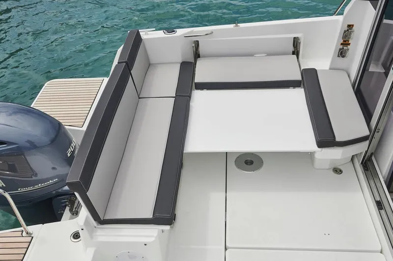 Slide: The Image of Manufacturer Provided Image: 2022 Jeanneau NC Weekender 795 Series 2 boat seating area with outboard motor - 35