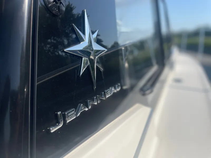 Slide: The Image of Close-up of Jeanneau NC Weekender 795 Series 2 logo on a 2022 model boat. - 4