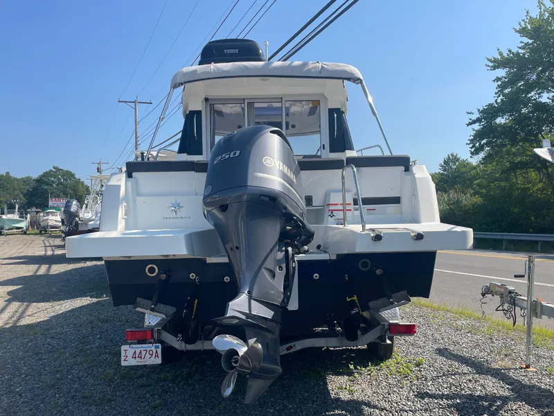 Slide: The Image of 2022 Jeanneau NC Weekender 795 Series 2 with Yamaha 250 engine, parked on gravel. - 5