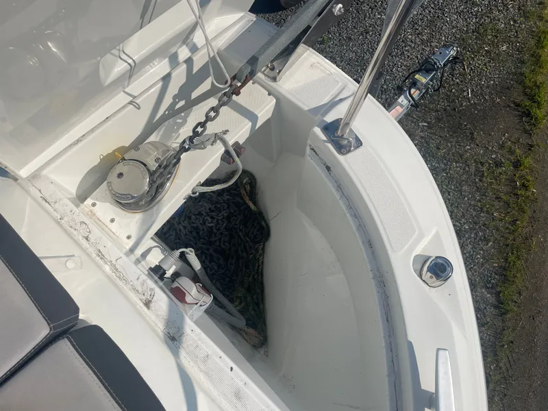Slide: The Image of Anchor compartment of 2022 Jeanneau NC Weekender 795 Series 2 boat, showing chain and winch. - 8