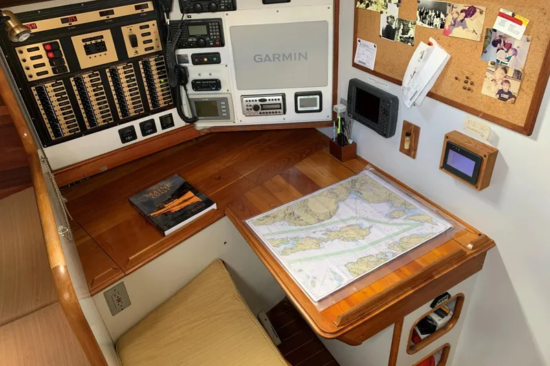 Slide: The Image of Navigation station of 1993 Brooklin Boat Yard Marshall 48 with map and control panels. - 21