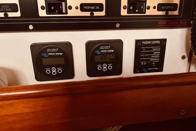 Slide: The Image of Control panel of a 1993 Brooklin Boat Yard Marshall 48 with Victron Energy displays. - 24