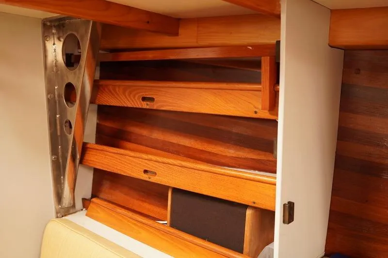 Slide: The Image of Interior of 1993 Brooklin Boat Yard Marshall 48 with wooden shelves and metal support. - 28