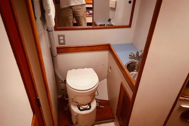 Slide: The Image of Bathroom interior of 1993 Brooklin Boat Yard Marshall 48 with toilet and sink. - 35