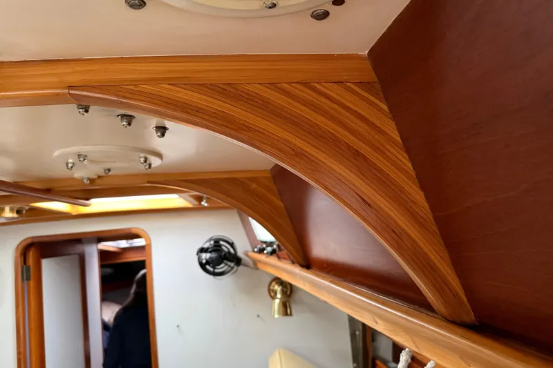 Slide: The Image of Interior of 1993 Brooklin Boat Yard Marshall 48, showcasing elegant woodwork and craftsmanship. - 37