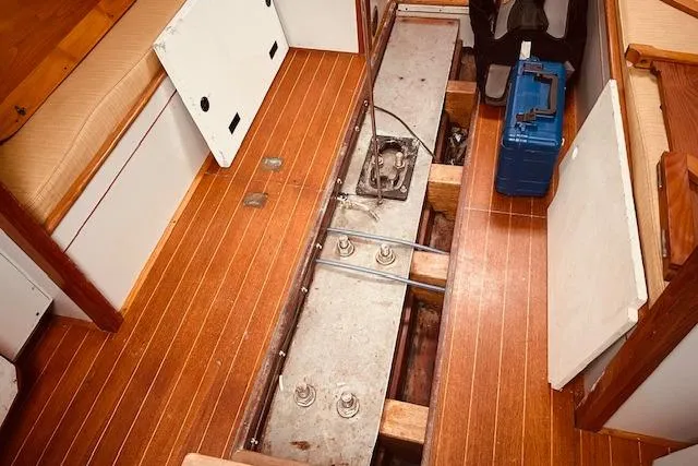 Slide: The Image of Interior view of 1993 Brooklin Boat Yard Marshall 48, showcasing wooden flooring and storage compartments. - 38